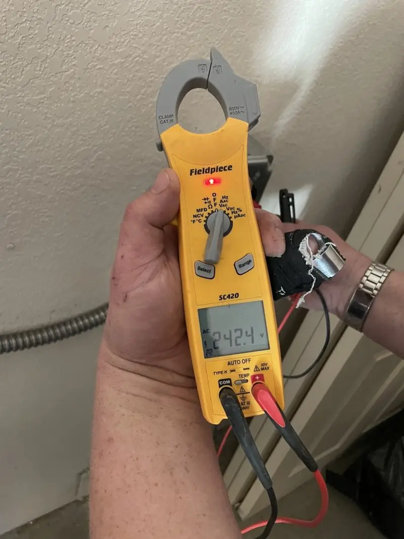 Voltage testing with clamp meter during Recessed Lighting Installation in Maryland Heights
